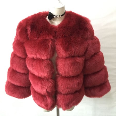 Woman wearing long faux fur winter coat outdoors