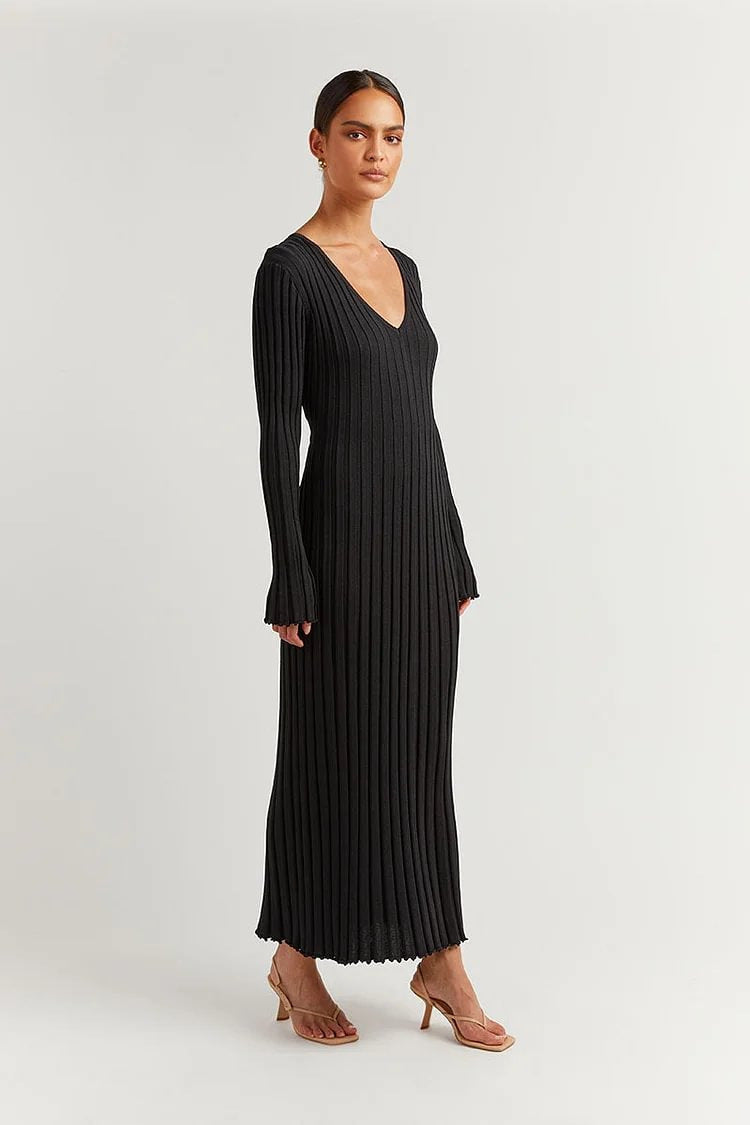 Woman wearing knit V-neck long sleeve dress