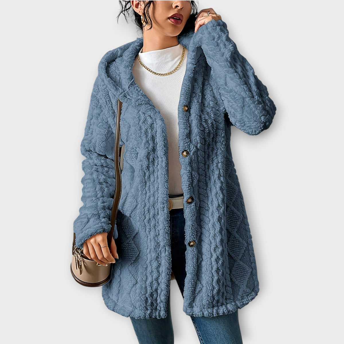 Woman wearing textured hooded winter jacket with relaxed fit