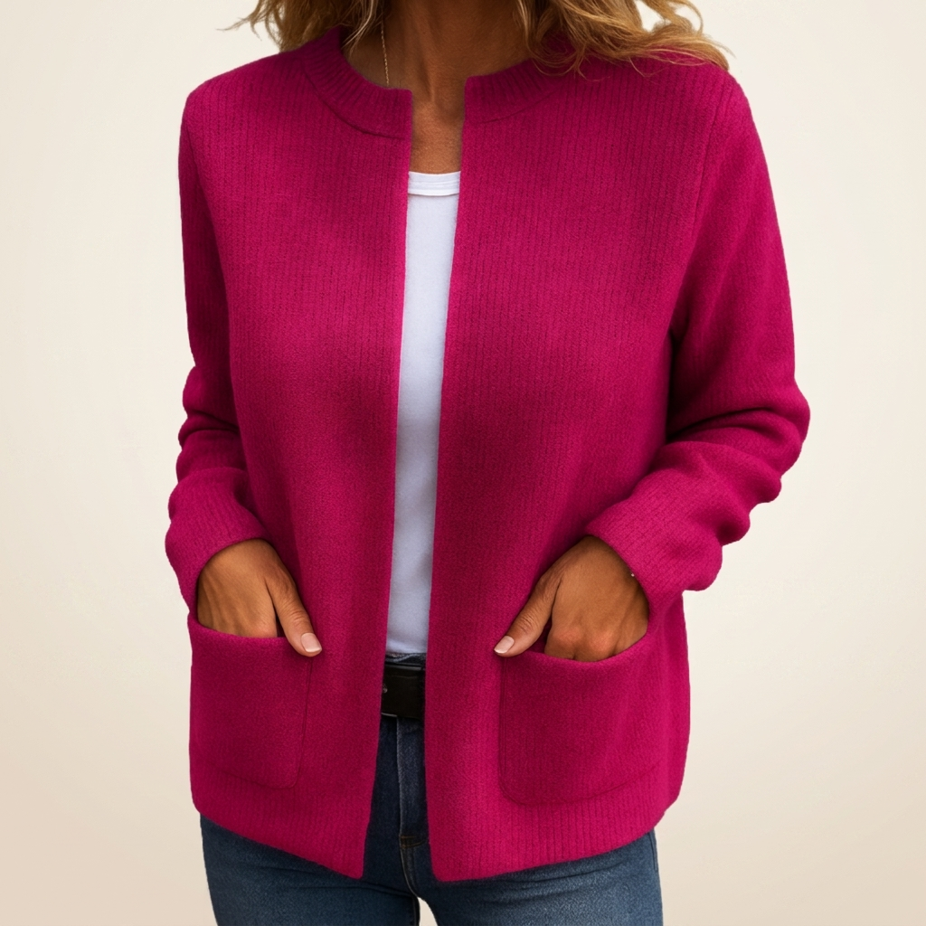 Woman wearing ribbed open front cardigan with front pockets