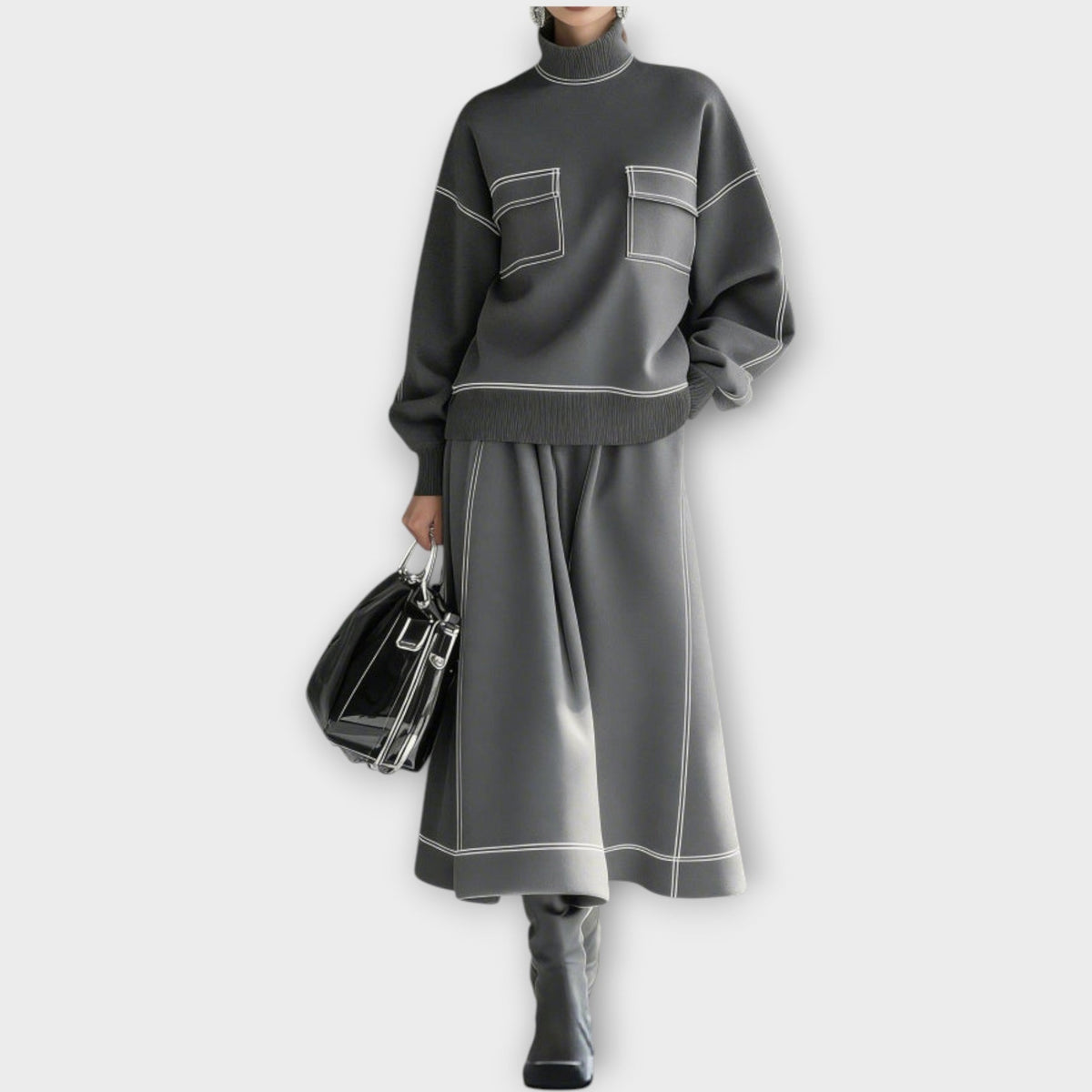 Woman wearing charcoal gray mock neck two-piece skirt set