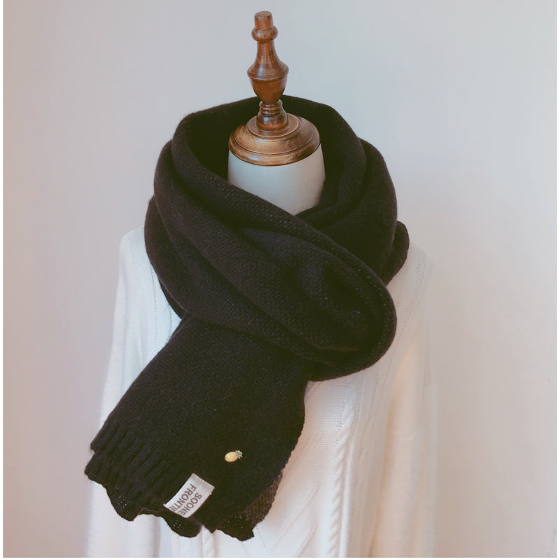 Woman wearing long winter scarf in imitation cashmere fabric