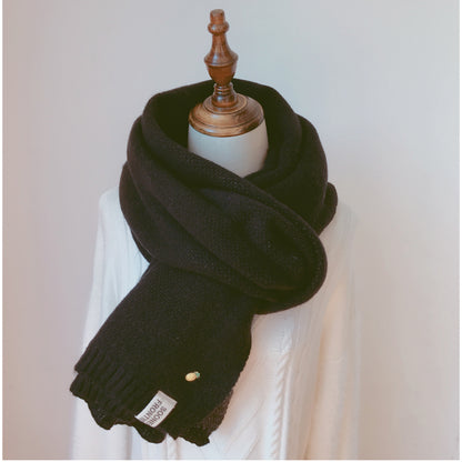 Woman wearing long winter scarf in imitation cashmere fabric