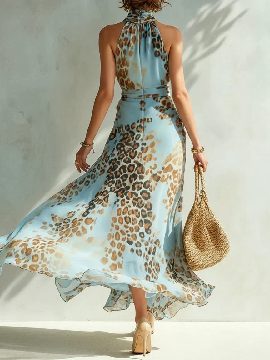 Woman wearing leopard print halter neck maxi dress