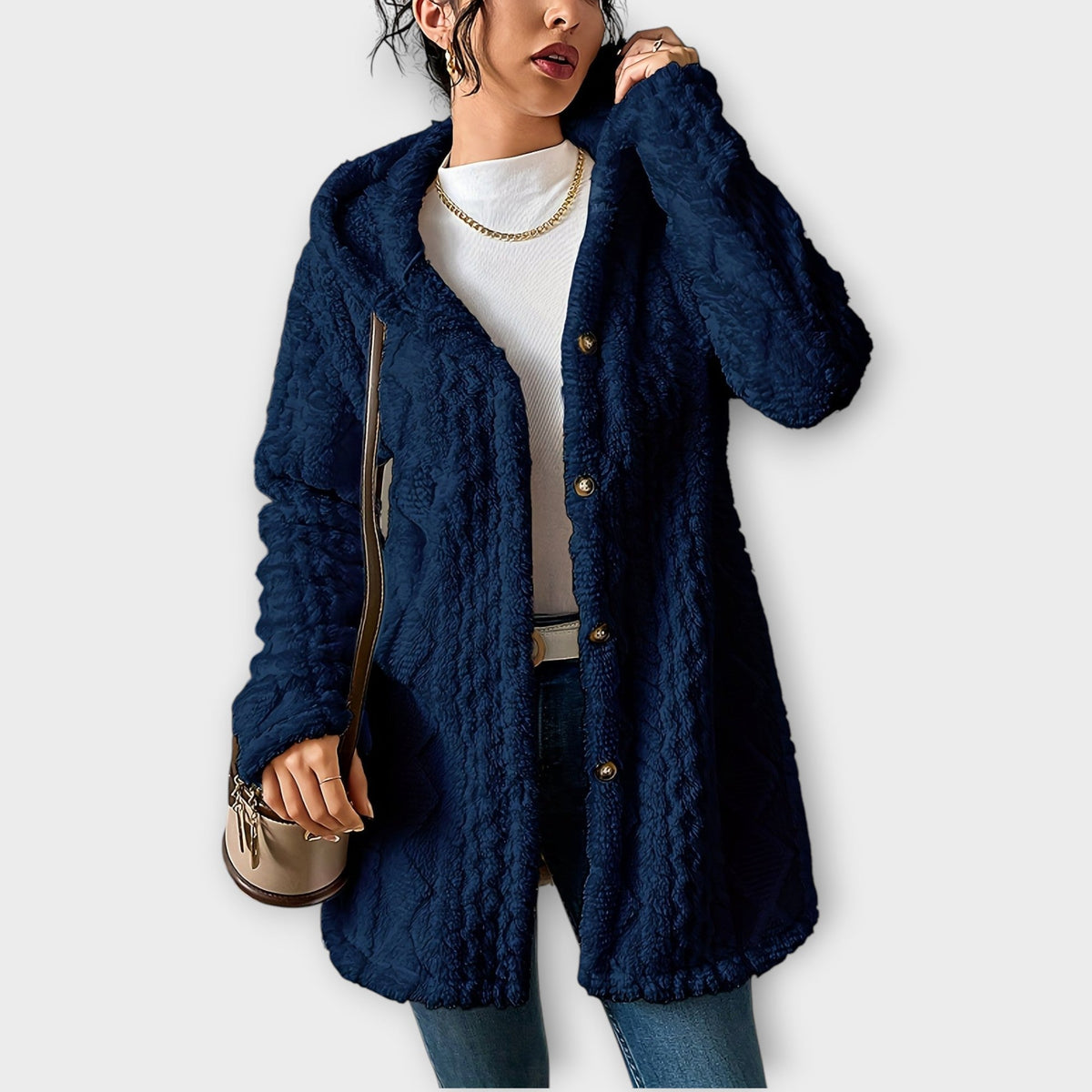 Woman wearing textured hooded winter jacket with relaxed fit