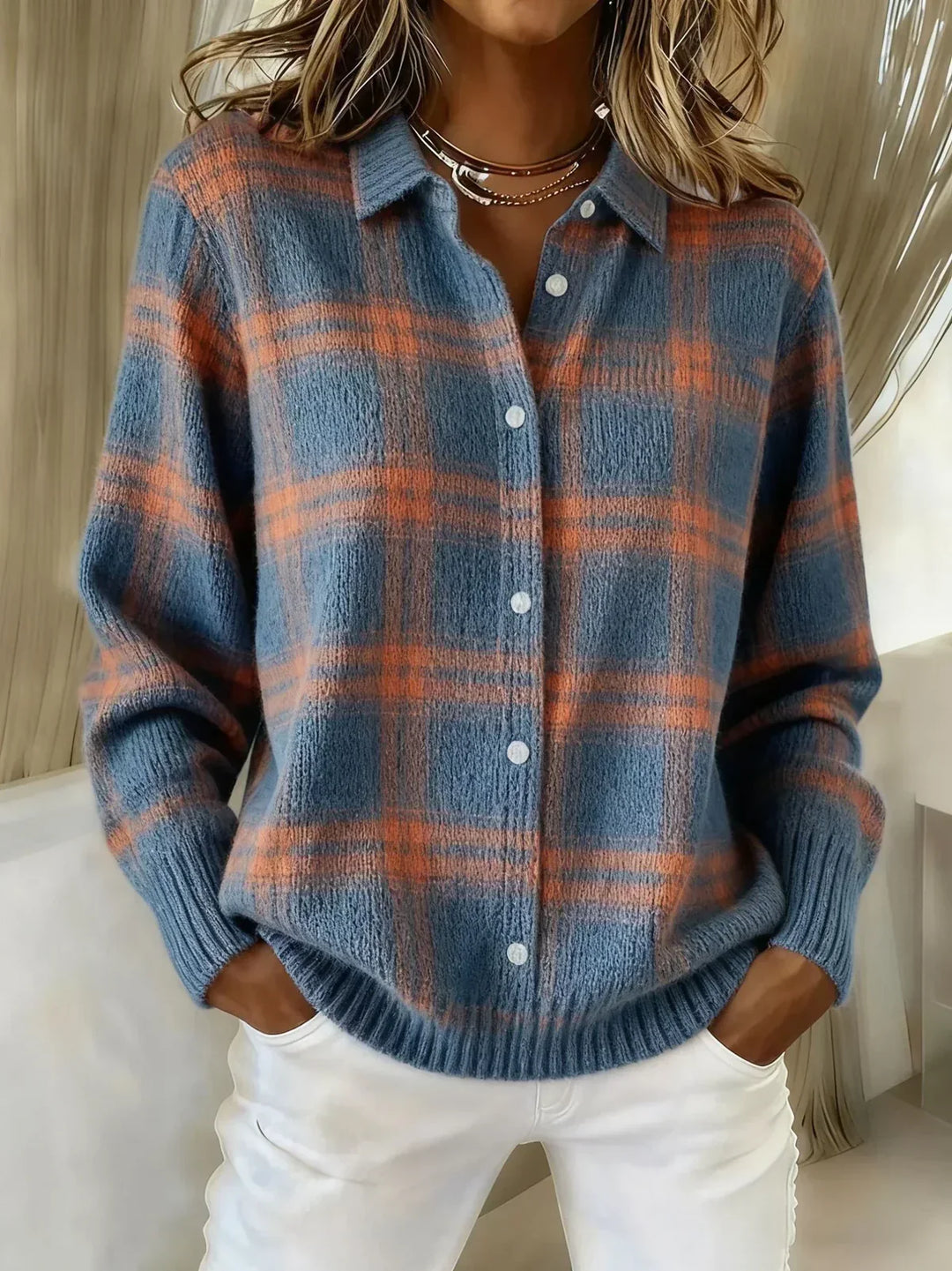 Woman wearing oversized plaid button-up knit cardigan