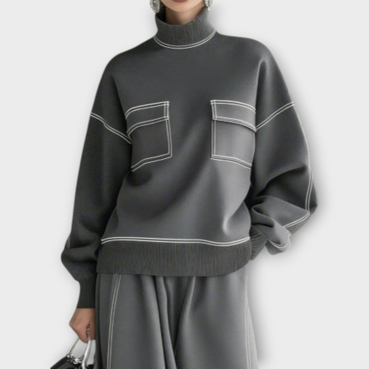 Woman wearing charcoal gray mock neck two-piece skirt set