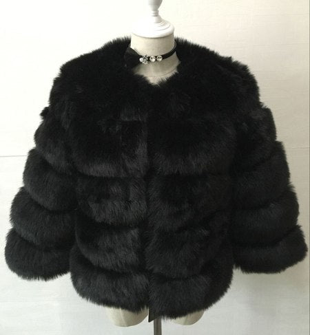 Woman wearing long faux fur winter coat outdoors