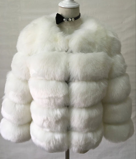 Woman wearing long faux fur winter coat outdoors