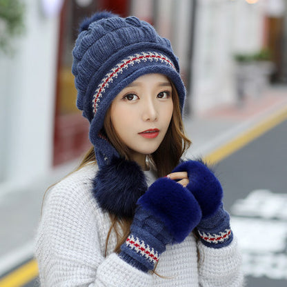 Women's knit beanie with ear flaps and pompom
