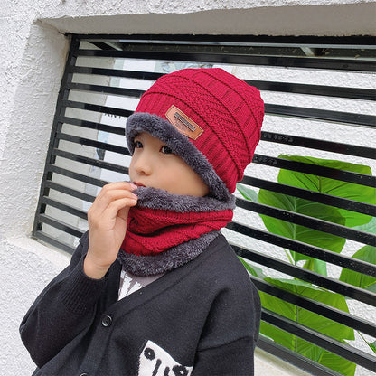 Women's knit beanie and scarf set in winter colors