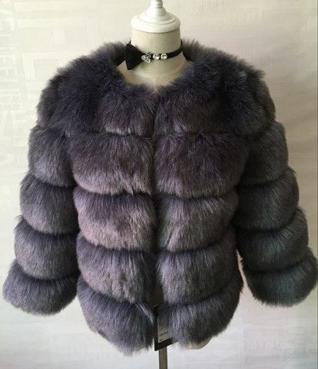 Woman wearing long faux fur winter coat outdoors