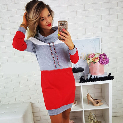 Woman wearing gray hooded long sleeve sweatshirt dress