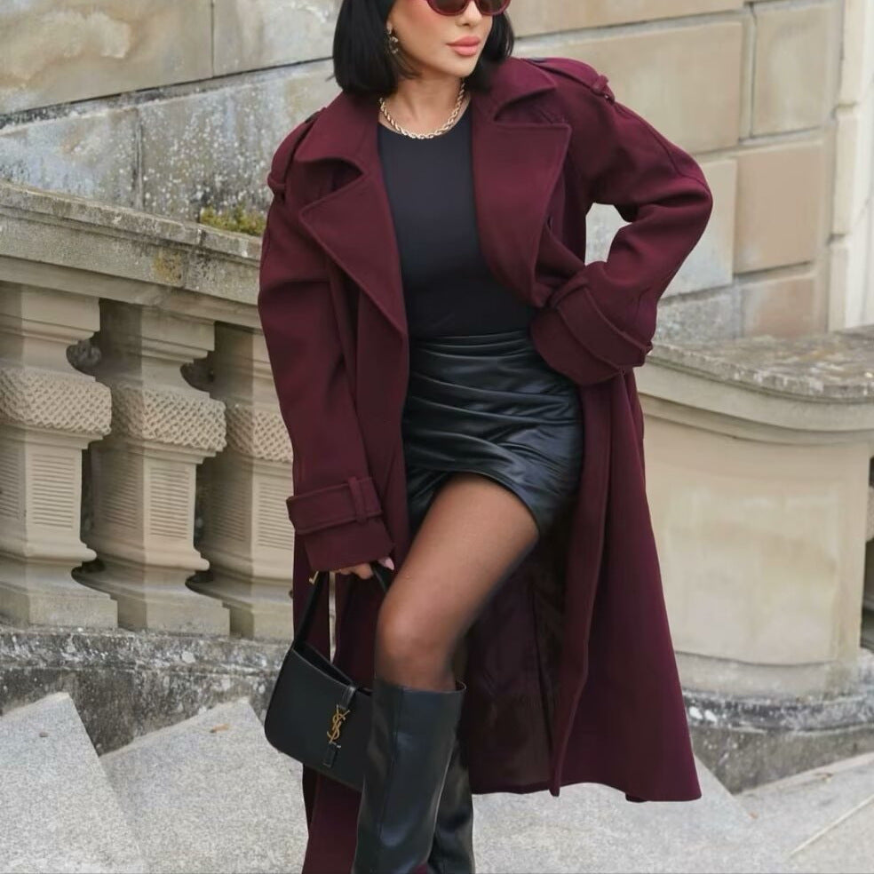 Woman wearing wine red double-breasted long coat with belt