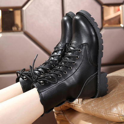 Black Martin boots with rivets and front tie