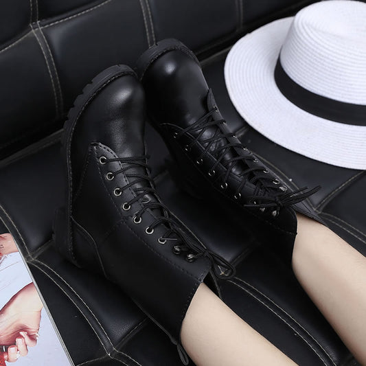 Black Martin boots with rivets and front tie
