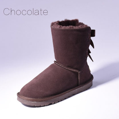 Women's mid-calf slip-on snow boots with bow detail