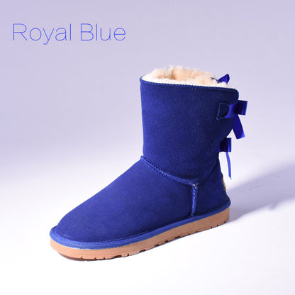 Women's mid-calf slip-on snow boots with bow detail