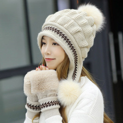 Women's knit beanie with ear flaps and pompom