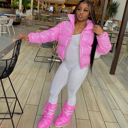Woman wearing black faux leather puffer jacket with zip front