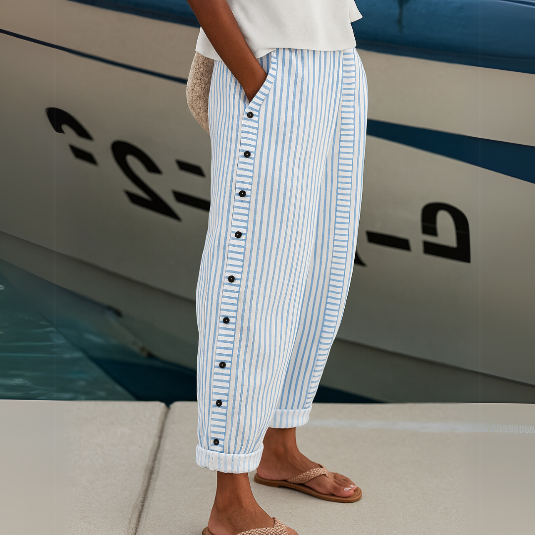 Woman wearing high-waisted striped button pants