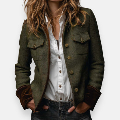 Woman wearing herringbone structured jacket with tailored fit