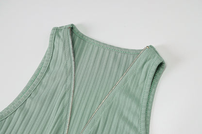Woman wearing green and pink striped knit sleeveless mini dress