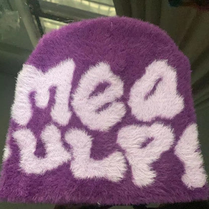 Woman wearing knit beanie hat in winter outfit