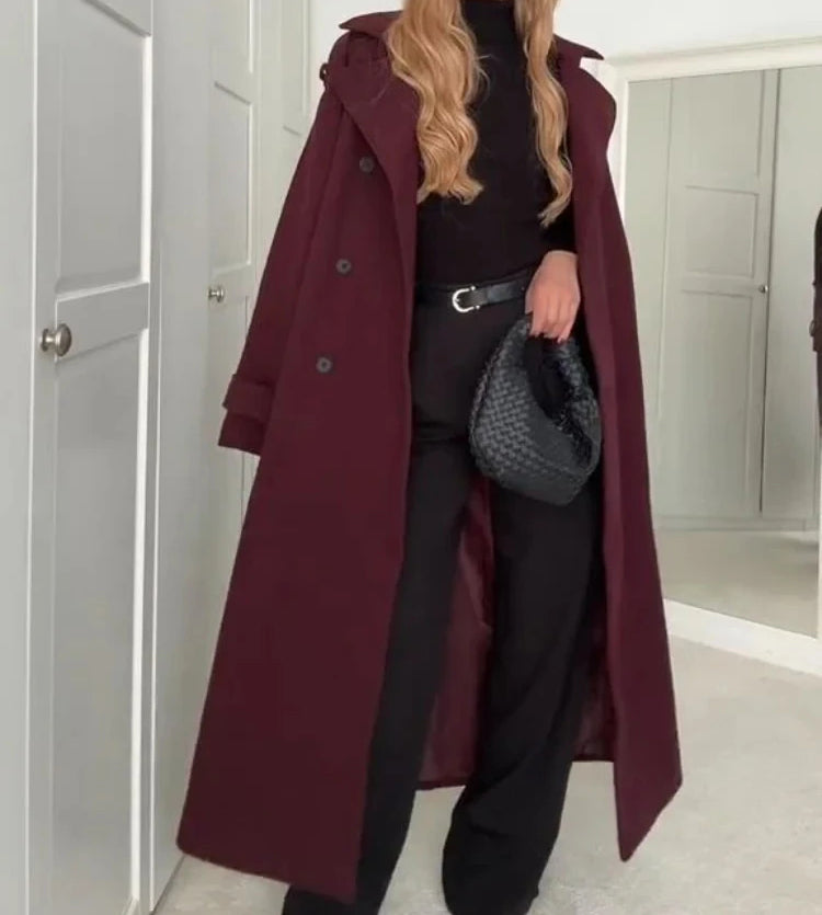 Woman wearing wine red double-breasted long coat with belt