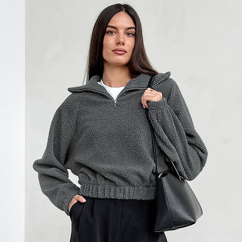 Woman wearing gray lamb fleece jacket with jeans