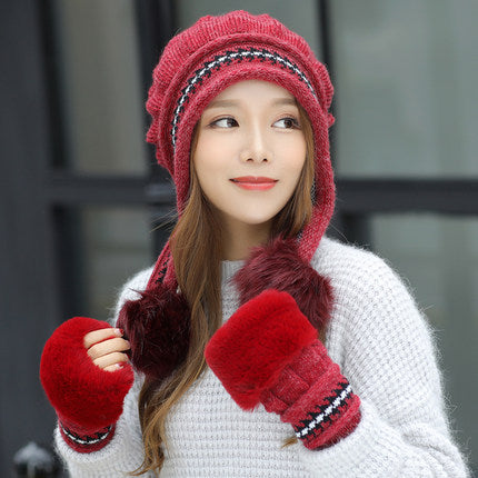 Women's knit beanie with ear flaps and pompom