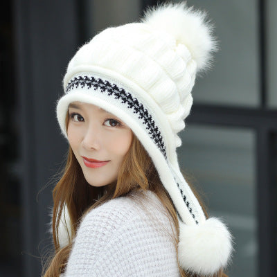 Women's knit beanie with ear flaps and pompom