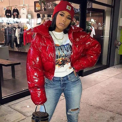 Woman wearing black faux leather puffer jacket with zip front