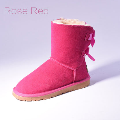 Women's mid-calf slip-on snow boots with bow detail