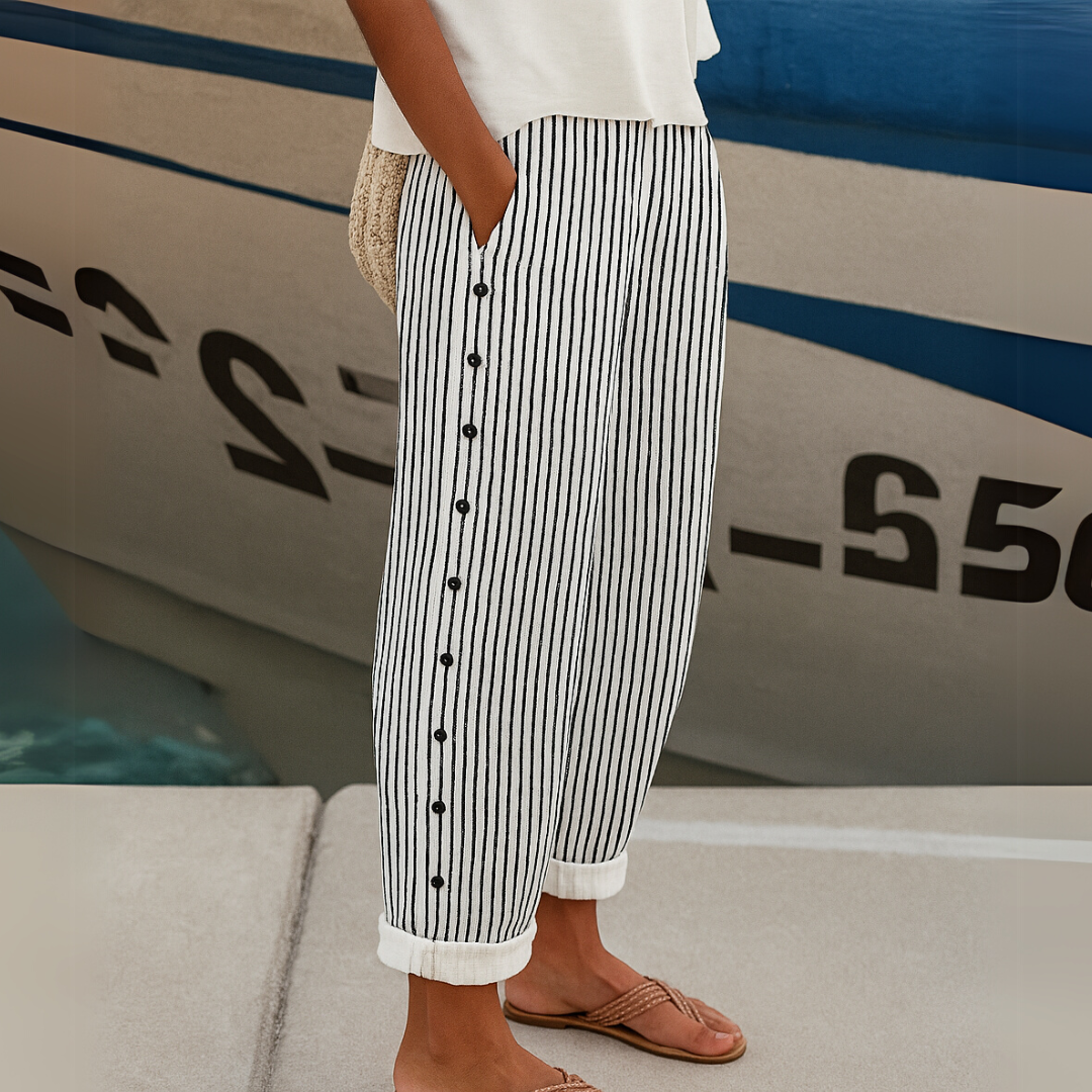 Woman wearing high-waisted striped button pants