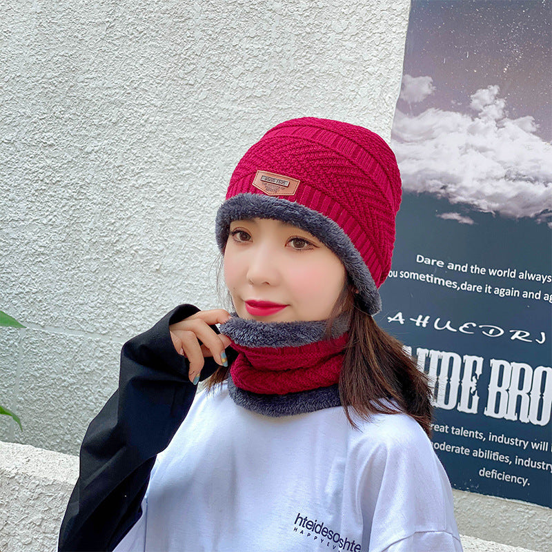 Women's knit beanie and scarf set in winter colors