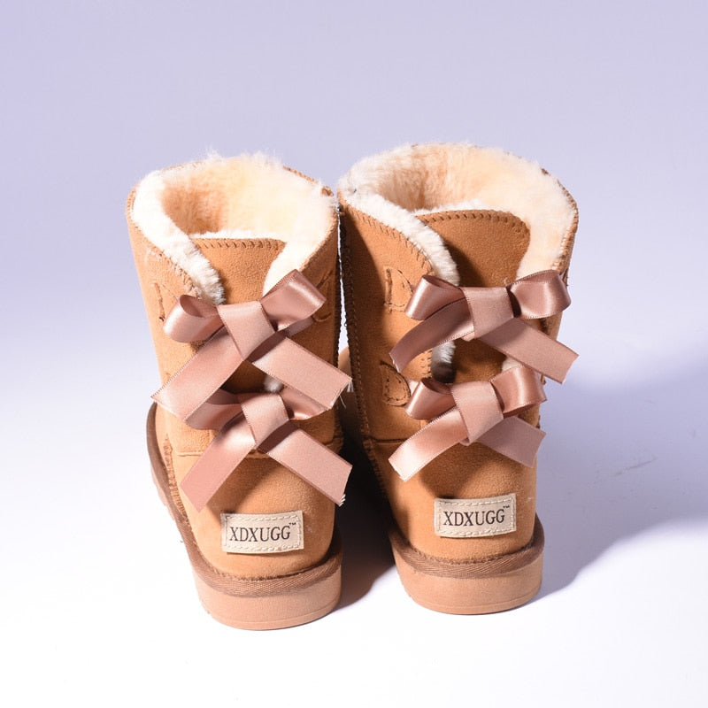 Women's mid-calf slip-on snow boots with bow detail