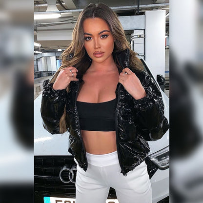 Woman wearing black faux leather puffer jacket with zip front