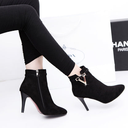 Women's high heel boots in black on white background