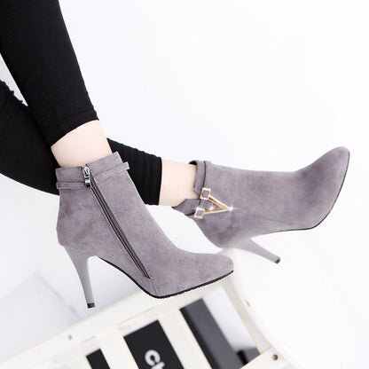 Women's high heel boots in black on white background