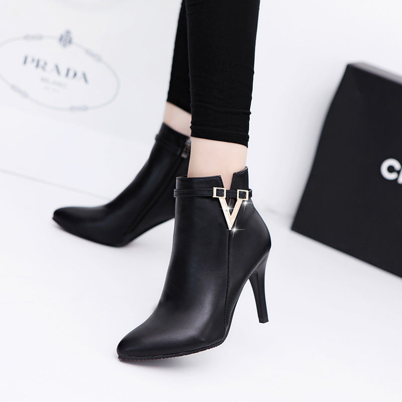Women's high heel boots in black on white background