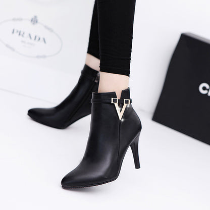 Women's high heel boots in black on white background