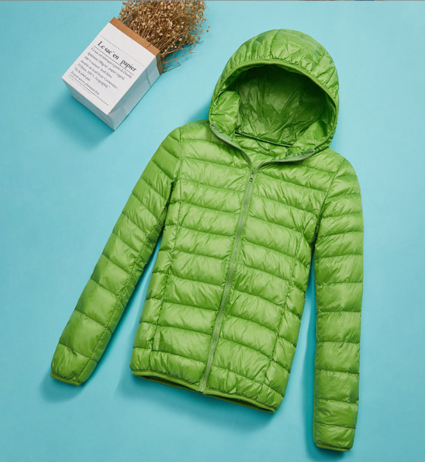 Woman wearing short hooded down jacket with zip front
