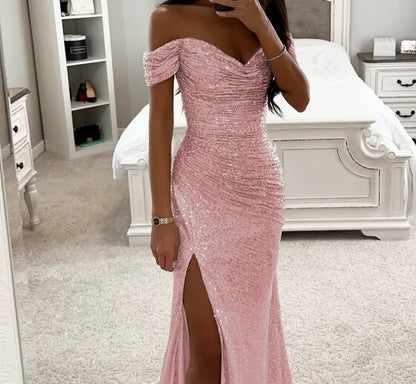 Woman in off-shoulder split party dress, solid color