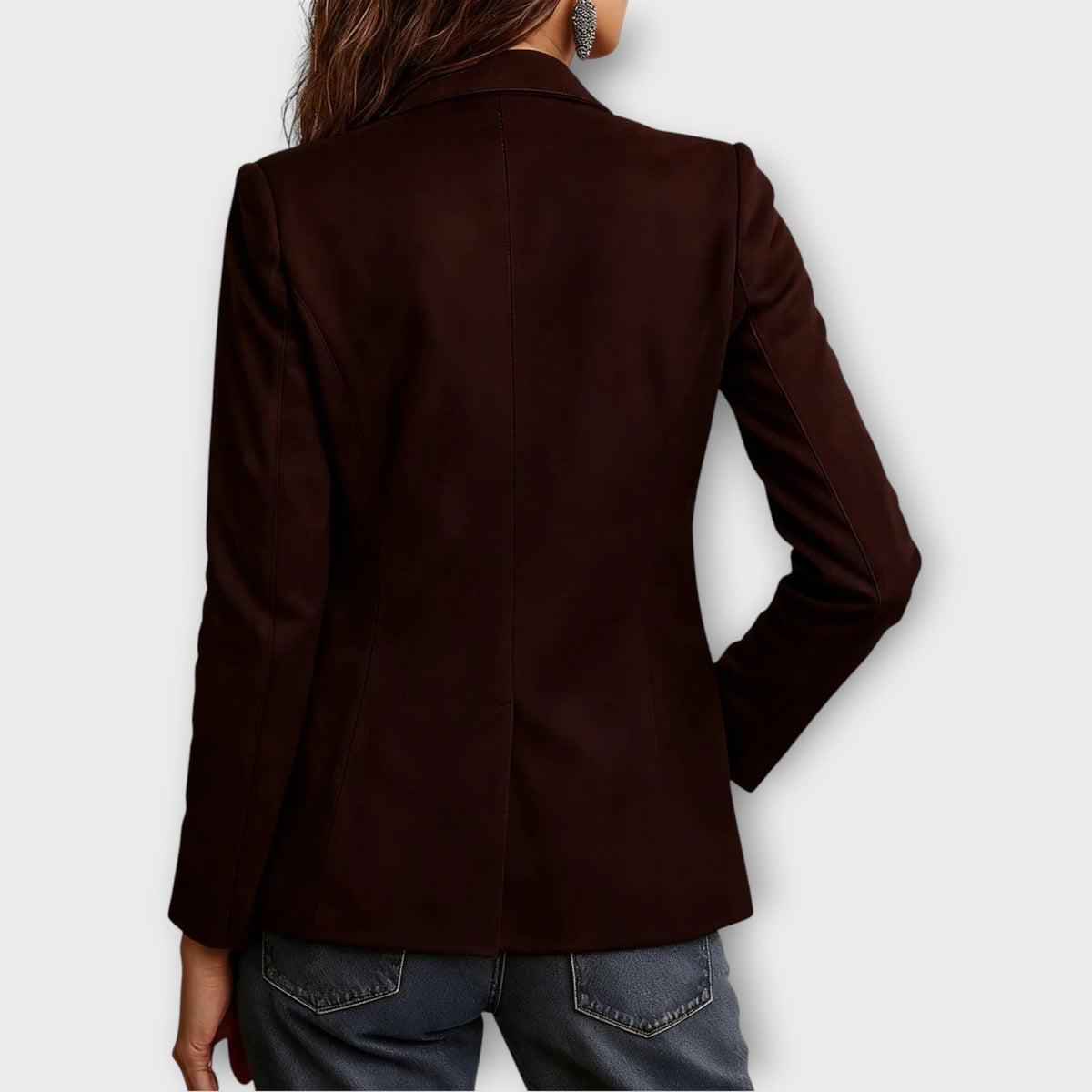 Woman wearing brown structured blazer with front buttons