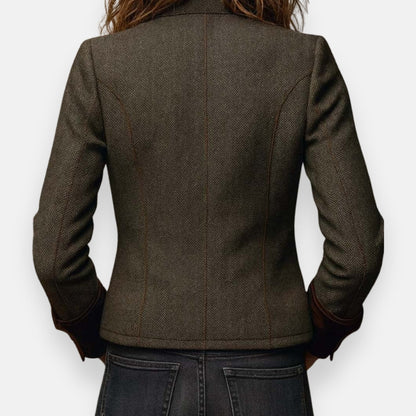 Woman wearing herringbone structured jacket with tailored fit