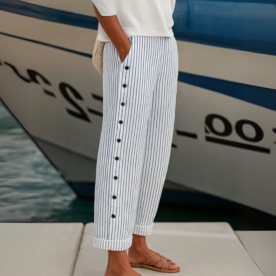 Woman wearing high-waisted striped button pants