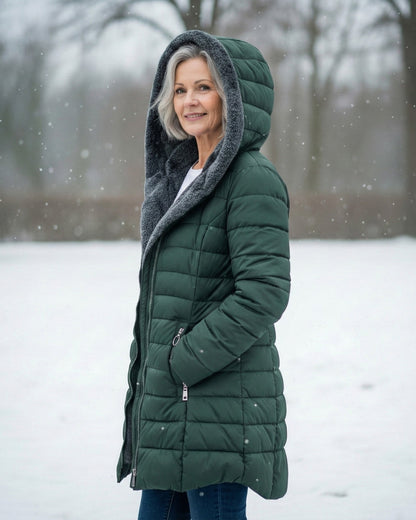 Woman wearing dark green fleece-lined A-line puffer coat
