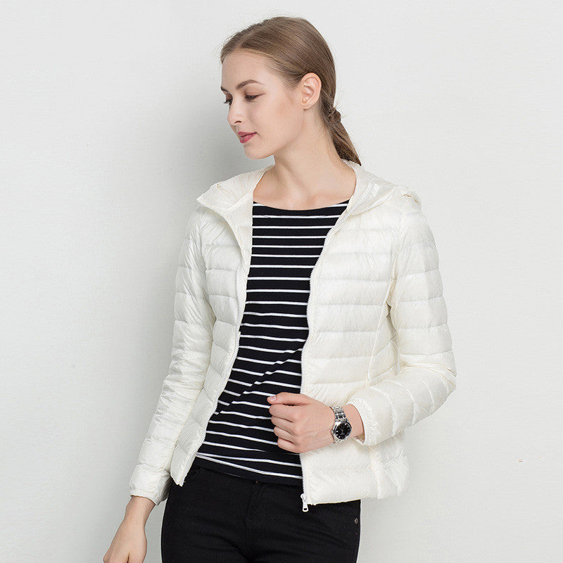 Woman wearing short hooded down jacket with zip front