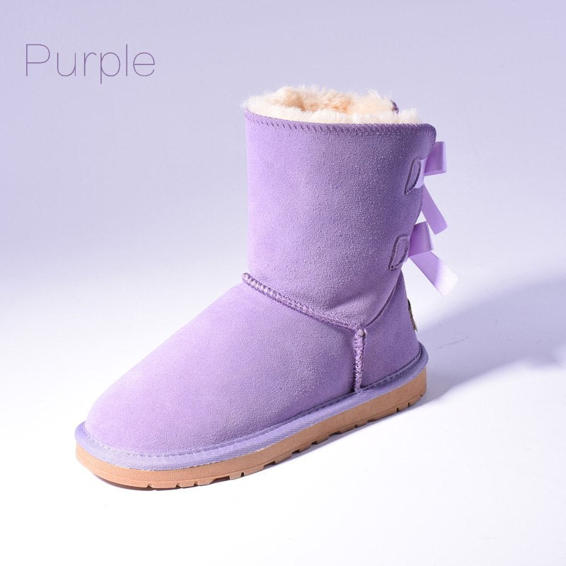 Women's mid-calf slip-on snow boots with bow detail